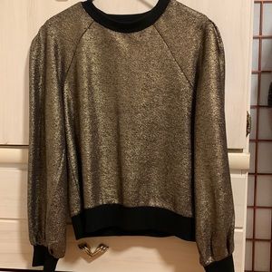 I am selling this Golden Glitter sweater that has never been worn.